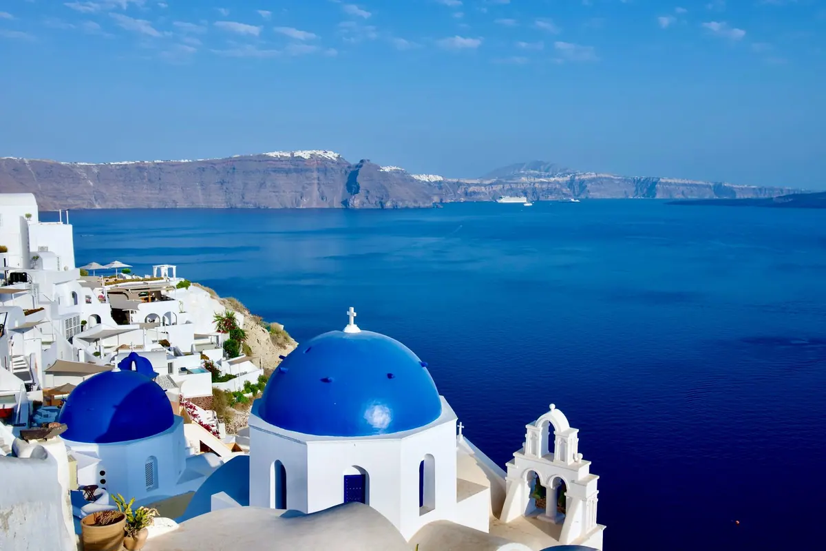 Blue-domed churches above the caldera in Santorini, Greece